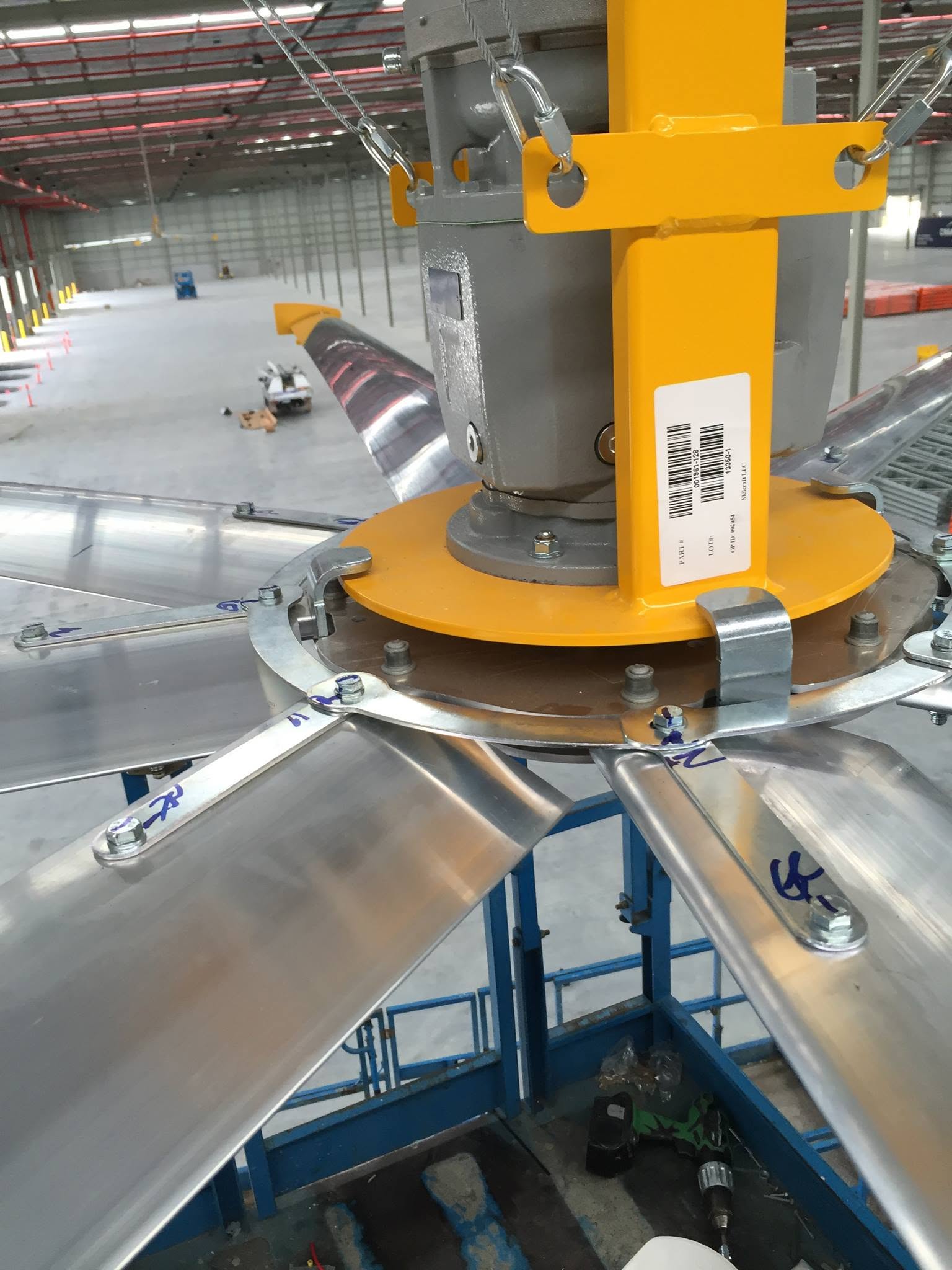 Close-up of an HVLS fan hub and blade mounts.