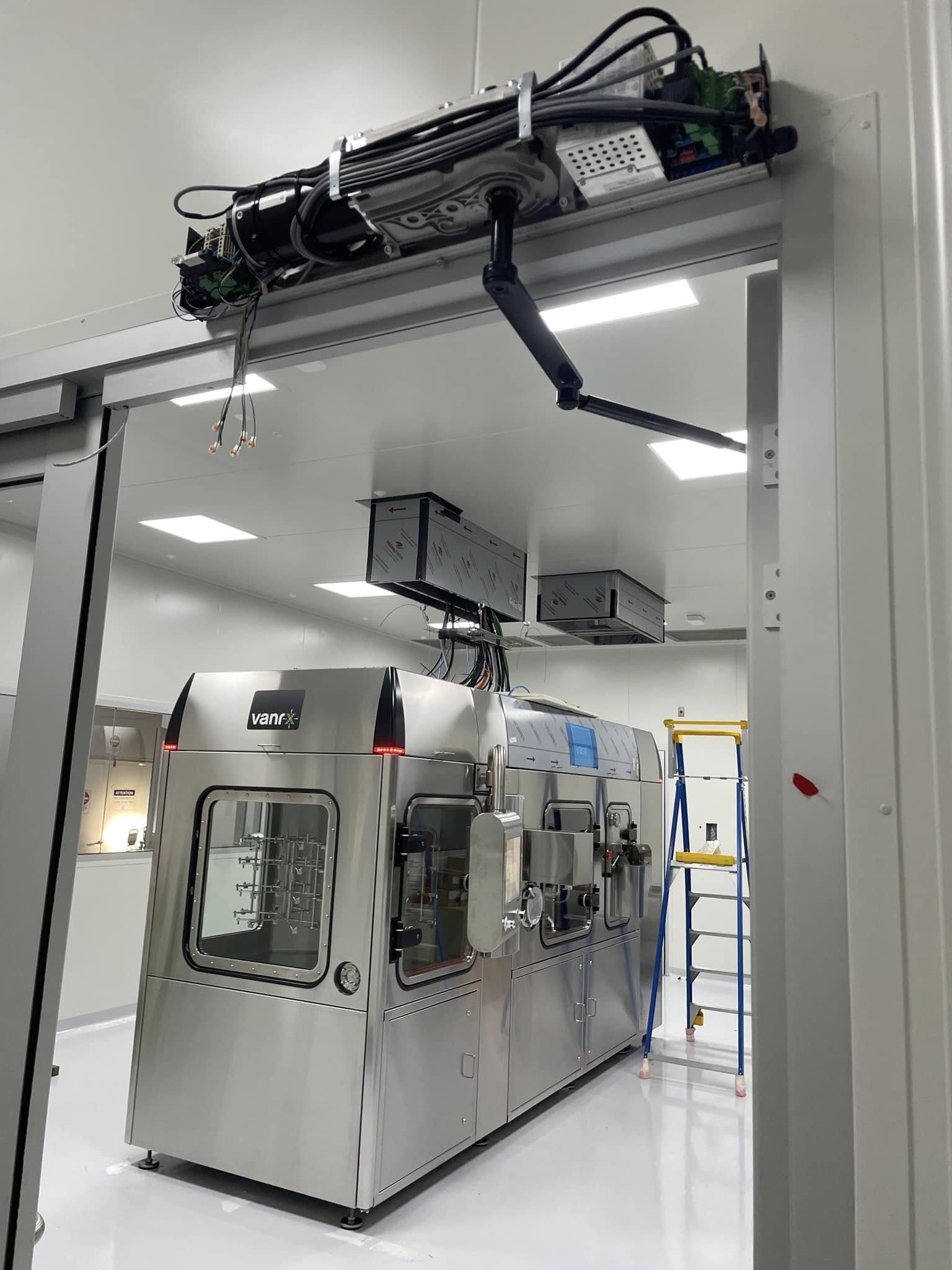 Autoclave and cleanroom equipment with overhead door automation.